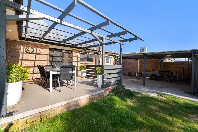 Rear pergola and lawn at 19 Bannerman Place, Holt