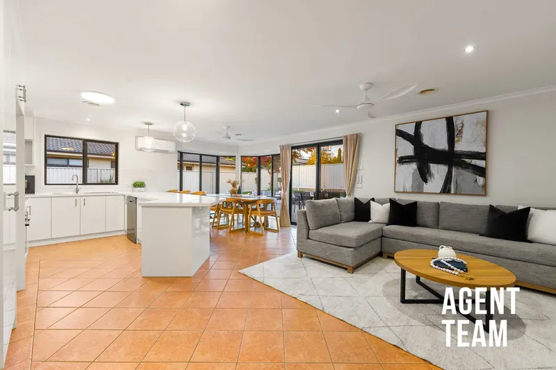 Open-plan kitchen, living and dining at 5 Quinlivan Crescent, Dunlop