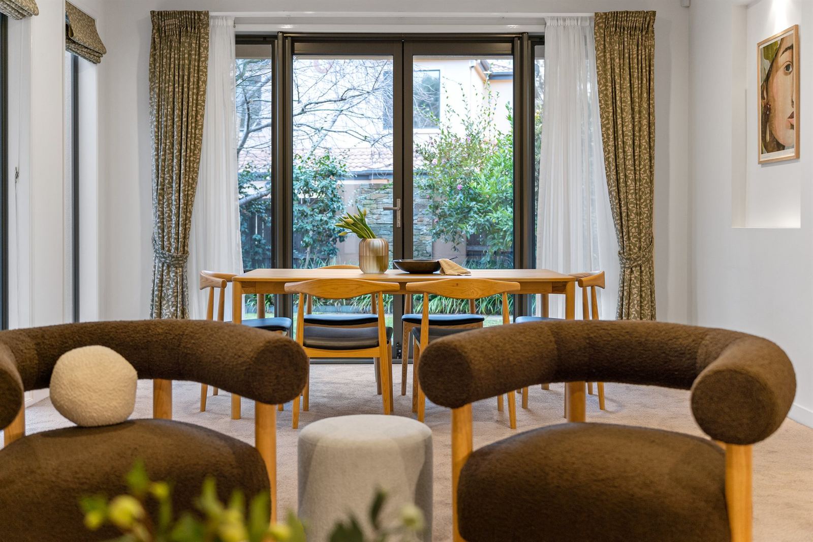 A styled dining room opening onto a Canberra garden