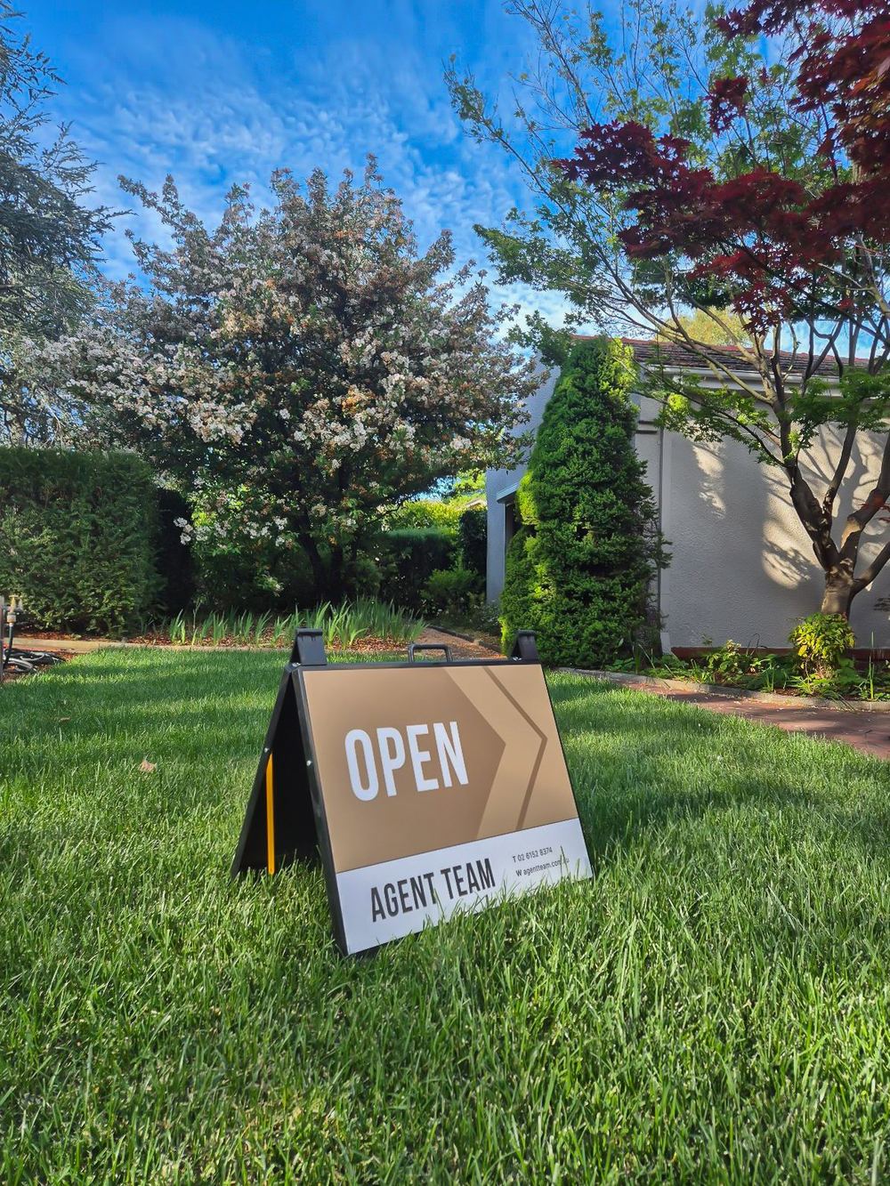 An Agent Team open home sign on a Canberra lawn