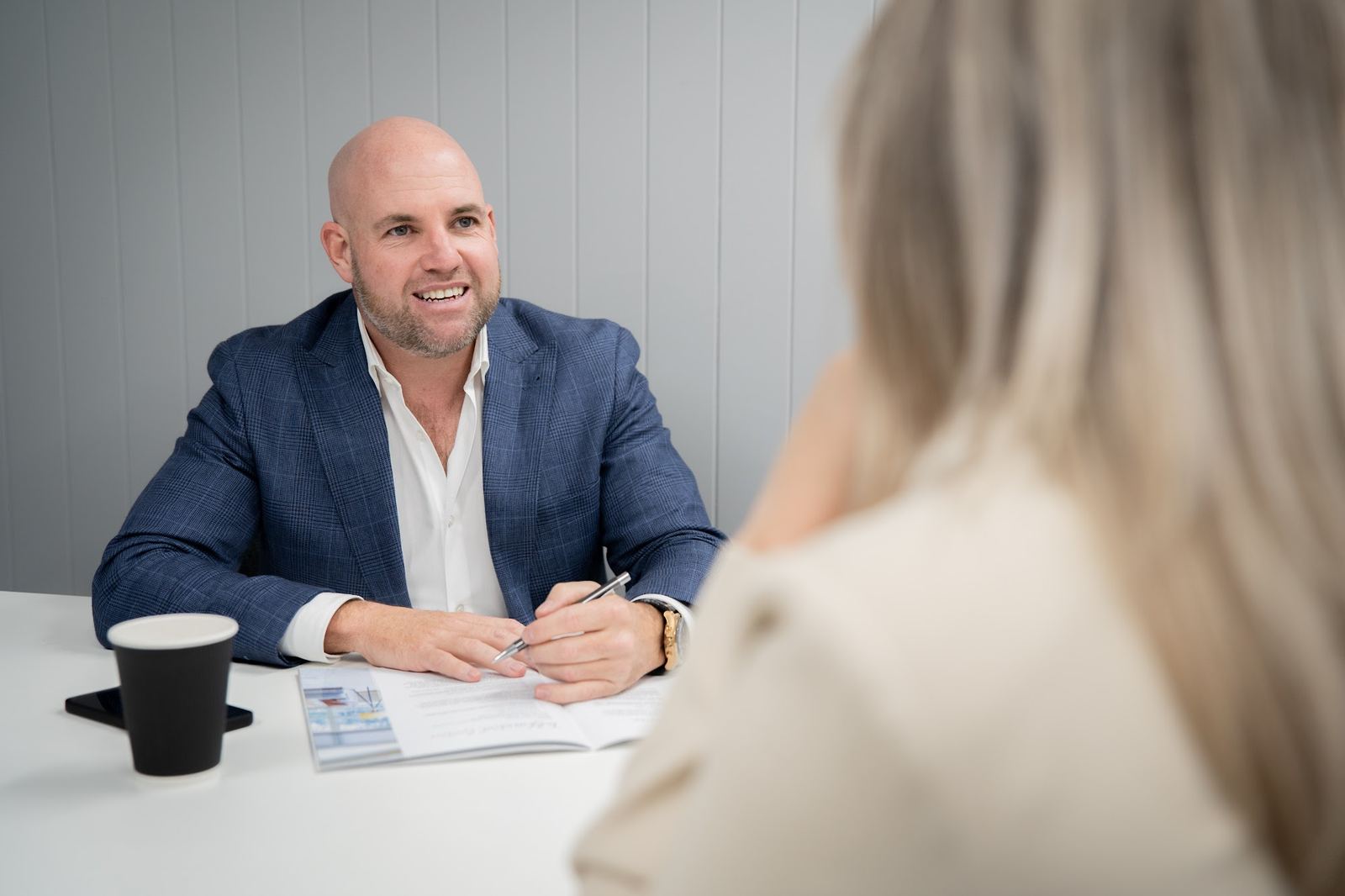 Steve Lowe of Agent Team talking with a client at a listing appointment