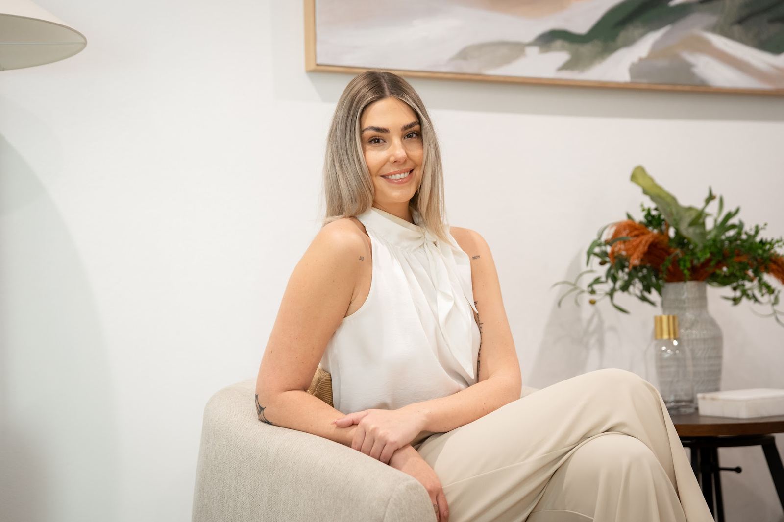 Victoria McLaughlin of Agent Team seated in a styled Canberra lounge