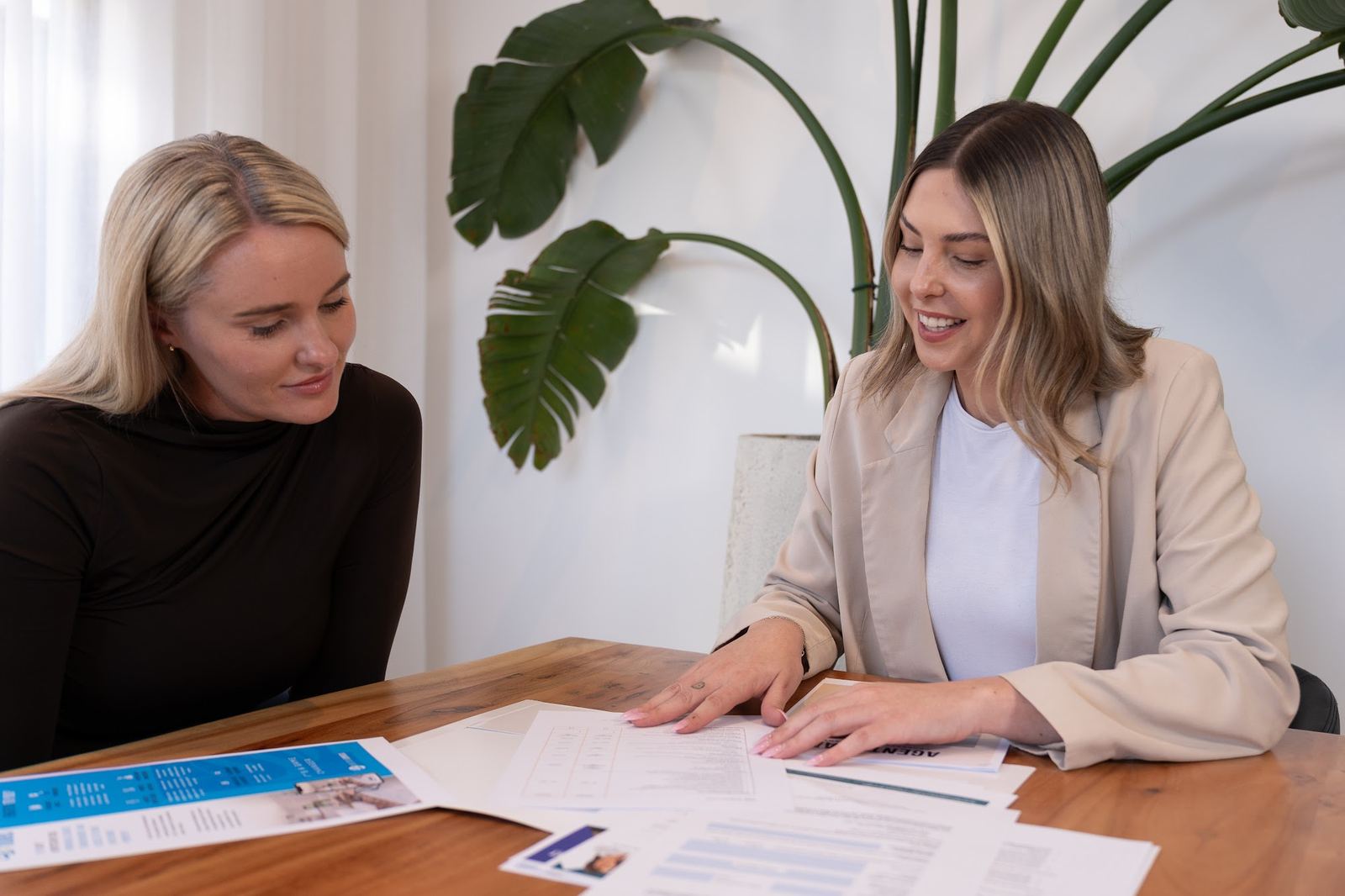 Victoria McLaughlin of Agent Team reviewing paperwork with a client